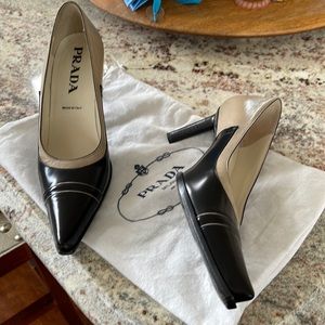 Prada 2and three quarter inch black and beige/ camel high heels.
